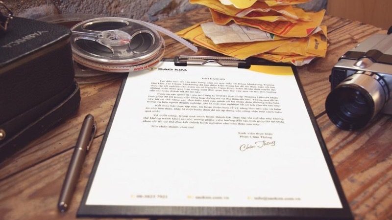 A lawyer reviewing and signing generated legal documents at a desk